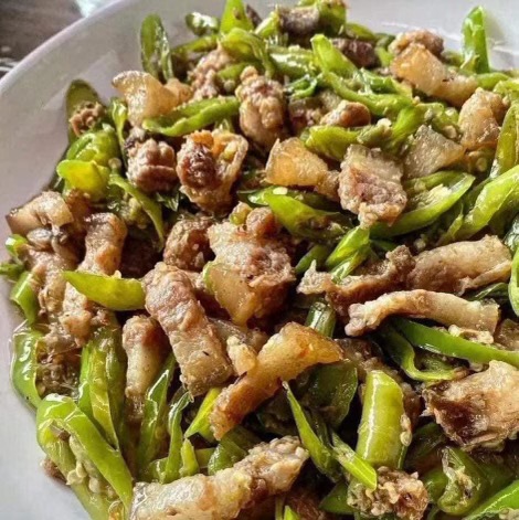 Bicol Express — pork simmered in coconut milk with peppers and aromatics